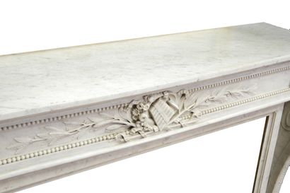  Louis XVI style mantel 
Arched lintel adorned with a median cartouche representing...