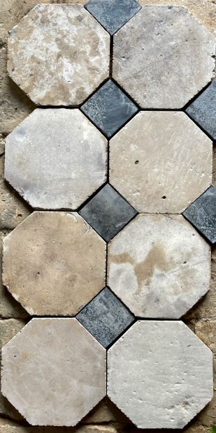 Octagonal stone paving with black slate cabochons....