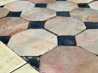  Terracotta tiles 
Octagonal pink-yellow-orange tiles with black cabochons and a...