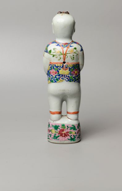 null CHINE, XVIIIème siècle. Statuette de Hoho debut tenant un vase aux lotus. Porcelaine...