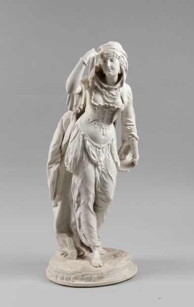 Bisque sculpture of an oriental dancer holding...