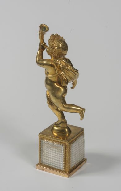 A gilt bronze child blower resting on a square...