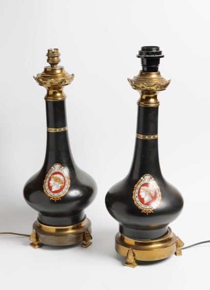 Pair of porcelain oil lamps with a black...