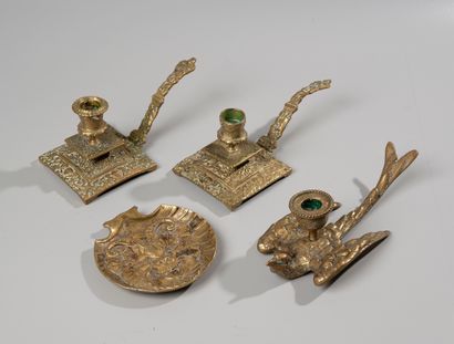 null A set of three bronze candlesticks and a cup with satyr decoration

around ...