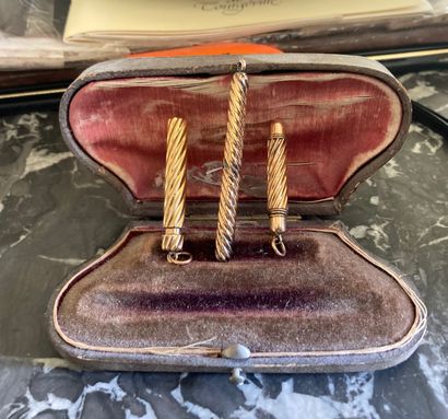 Three mechanical pencils in gold and silver.

A...