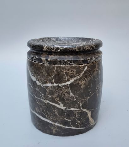 A covered pot in black and white veined marble...