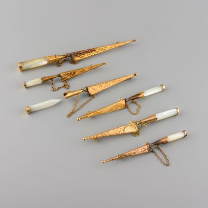 Six gold and mother-of-pearl dagger brooches...
