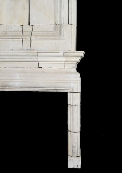  Louis 13 mantel. 
With double cornice, the trumeau adorned with a molded frame topped...