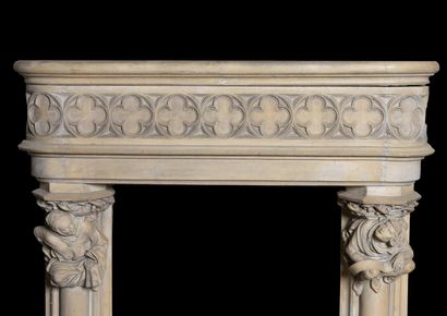  Neo-Gothic mantel. 
Lintel adorned with a frieze of shamrocks, column jambs topped...