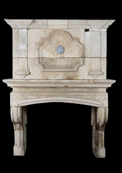  Louis 13 mantel in hard stone. 
Console jambs supporting a curved lintel. 
Trumeau...