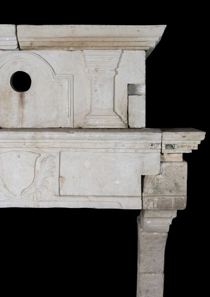null Louis 13 stone mantel.

Lintel decorated with a central escutcheon. 

Mantel...