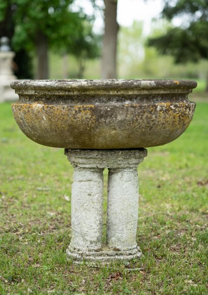 Baptismal basin in stone. 
Monolithic bowl of oblong shape resting on a foot with...