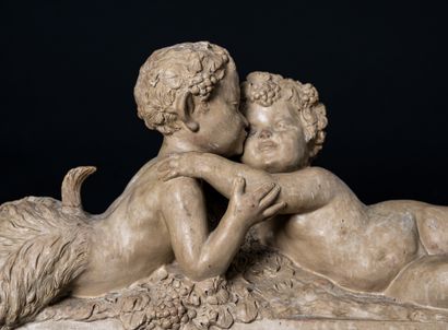  Putto and faun. 
Sculpture with the image of a Bacchanalian scene illustrated by...