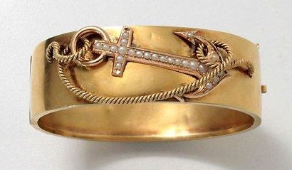 null Bracelet rigide ouvrant en or, à décor marin appliqué d'une ancre rehaussée...