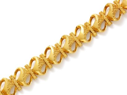 Bracelet articulé en or 750 millièmes, composé...