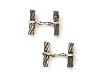 null HERMÈS PARIS
Pair of silver cufflinks 800 thousandths, decorated with twisted...
