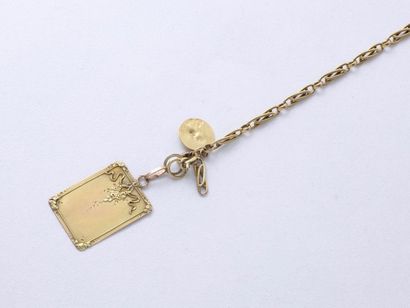 null Bracelet en or 18 K composé d'une chaînette accidentée retenant 2 médaille.(en...
