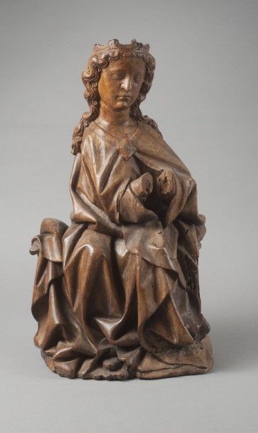 null Vierge assise

Noyer

France, XIVe siècle

Haut. : 40,5 cm- Larg. : 23 cm –...