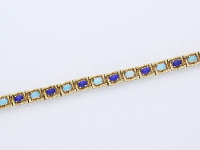 null Bracelet articulé en or 750 millièmes, décoré de cabochons d'opale intercalés...