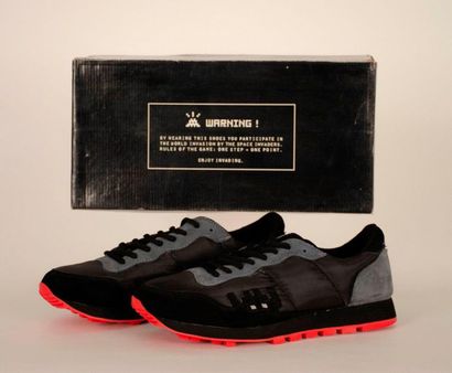 INVADER (Français, né en 1969) Black sneakers with its Invader tag inside 

With...