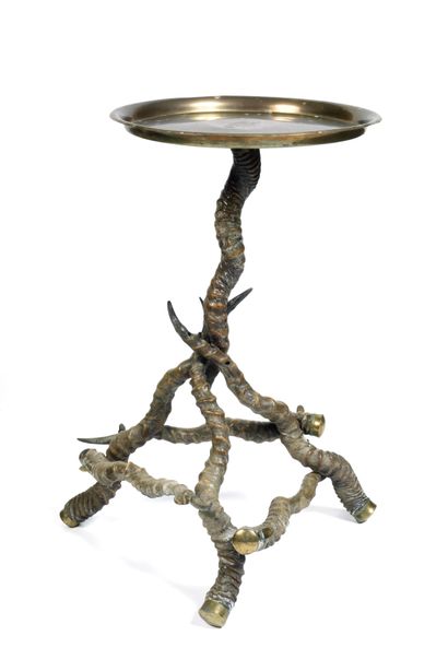 null Pair of tables with base made from an assembly of raw horned cases of antelope...