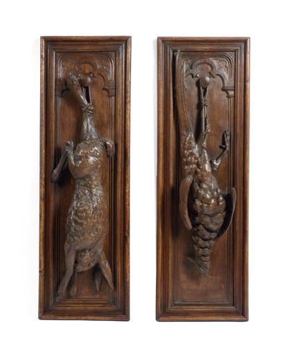 null Pair of panels, carved with still life decoration

of pheasant and hare

100...