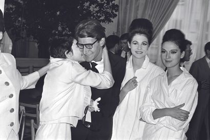 AFP AFP

French dancer Zizi Jeanmaire kisses the designer Yves Saint-Laurent on July...