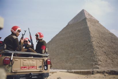 AFP AFP - Mike NELSON

Soldiers patrol in front of the Egyptian pyramids

on February...