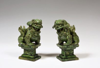 null 
China

A pair of green enamelled stoneware Fô dogs, sitting on rectangular...