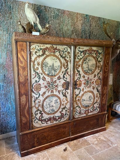 null Cupboard with painted foliage scrolls and four medallions with landscape decoration...