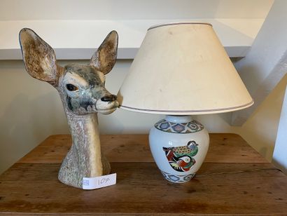 null Earthenware sculpture decorated with a deer's head

H: 44 cm

A lamp with a...