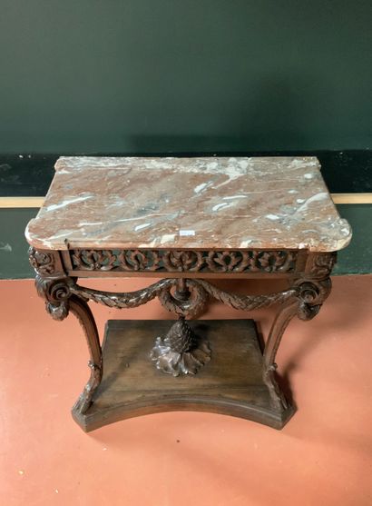 null Carved oak console with an openwork belt with foliage, it rests on three cambered...