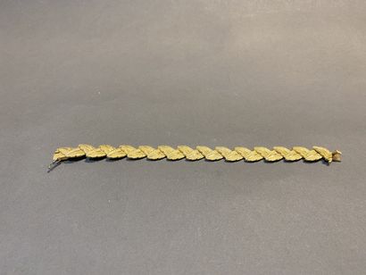 null Bracelet articulé en or 750 °/°° à maillons à motifs de feuilles. 

Poids :...