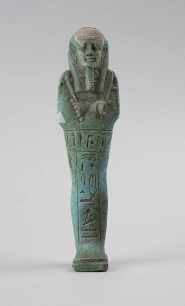 null Oushebti en faïence verte

Egypte basse époque

H. 17 cm.