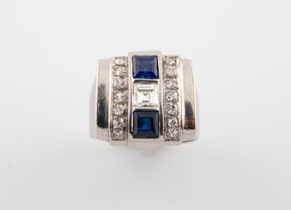 null Platinum signet ring centered with a square-cut diamond and two calibrated blue...