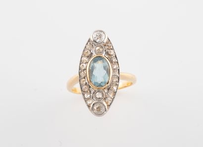 null Marquise ring in two gold 750 °/°° set with an aquamarine and a fall of diamonds...
