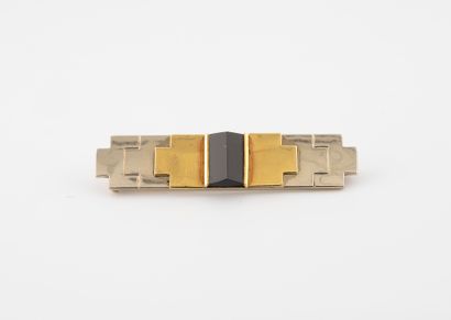 null Art Deco brooch in two-tone 750°/°° gold with a geometrical motif enhanced by...