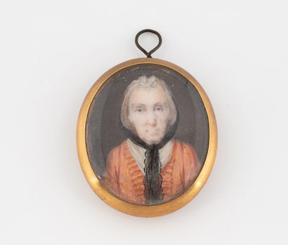 null Pendentif en métal doré orné d'un portrait féminin portant une mantille en miniature.
Travail...