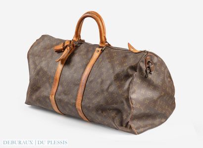 null Louis VUITTON. 
Keepall model travel bag in monogrammed canvas and leather....
