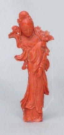 null Sujet en corail orange représentant une jeune femme tenant une branche fleurie....
