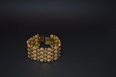 null Bracelet ruban articulé en or ciselé 750°/°°, à motif de fleurettes

P: 61,...