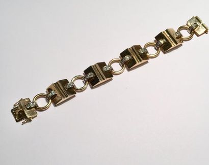 null Bracelet articulé en or (585 millièmes) et en argent (950 millièmes) à motifs...