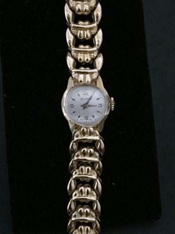 null Bracelet montre de dame "Avion" en or 750 °/°° rehaussé d'un bracelet à attaches...