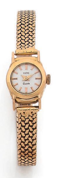 LUXE * Ladies' wristwatch, round case and wrist strap woven ribbon in yellow gold....