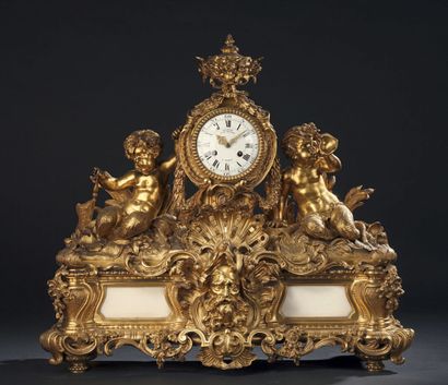 null Clock in gilt bronze and white marble, the dial with Roman and Arabic numerals...
