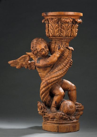 null Carved wooden saddle composed of a cherub holding a horn of plenty from which...