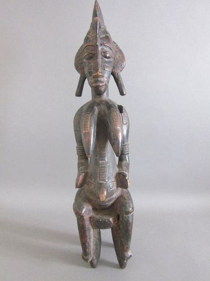 Statue africaine féminine au corps scarifié...