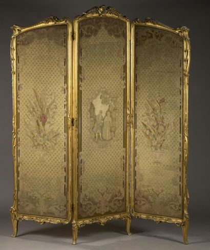  Gilded carved wooden screen with foliage and 
flowers, the upper part curved, the...