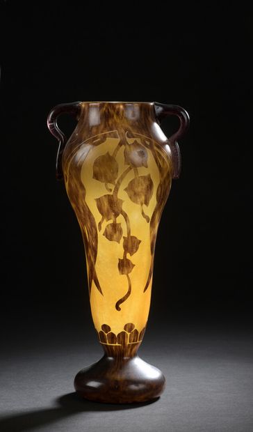  FRENCH GLASS 
A conical vase with a swollen body on a pedestal and two lateral handles...