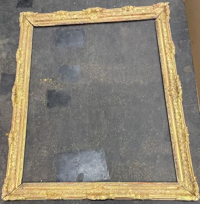 
Large giltwood frame molded and carved with...